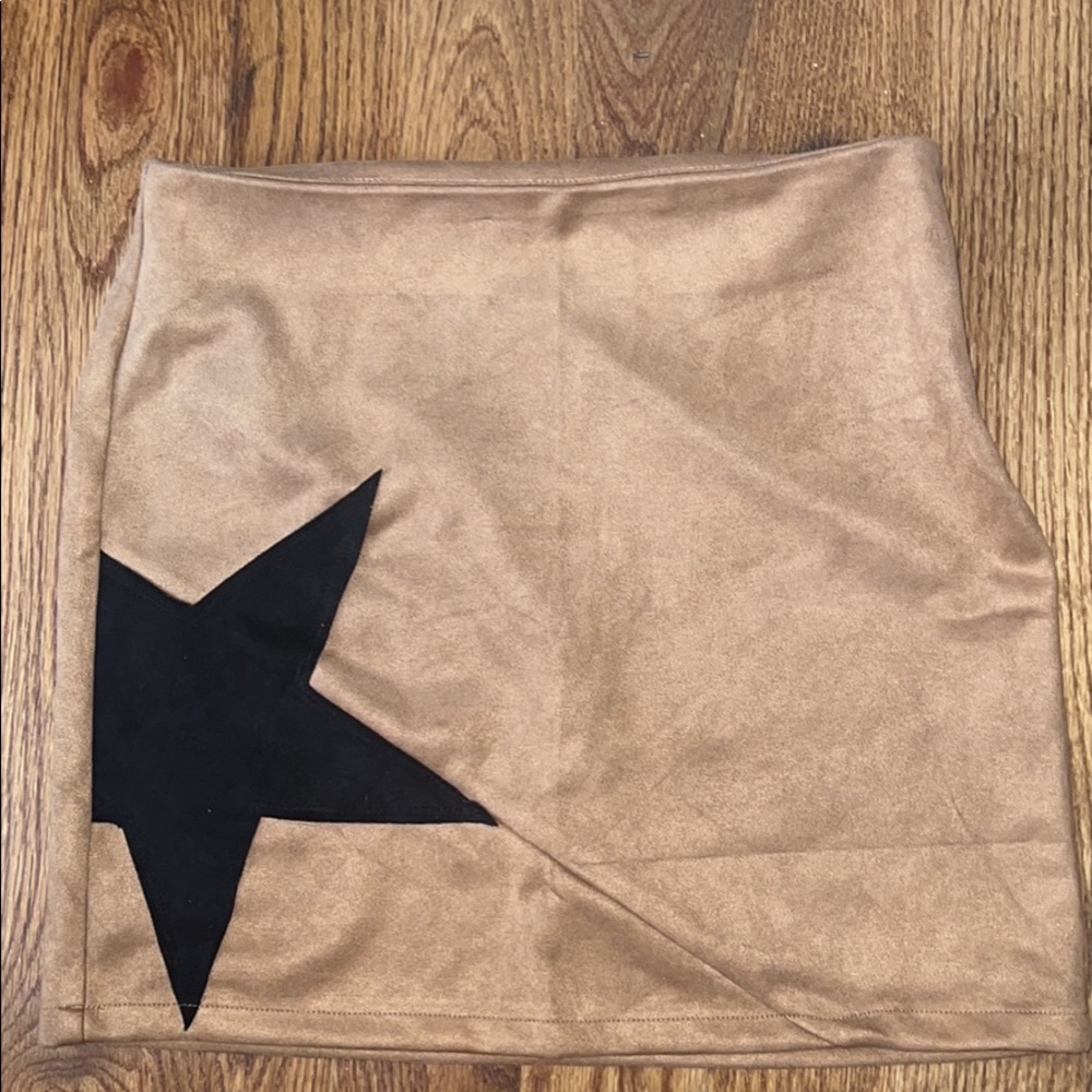 Tan suede mini skirt with black star